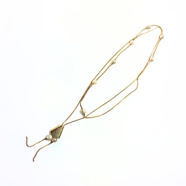Colar de gravata com pérolas dourado